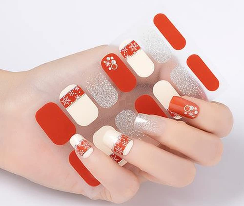 Christmas Snowflake Inspired Red and Beige Fingernail Art Wraps Silver Glitter and Full of Rhinestones Show Your Holiday Spirits with These Cute Wraps